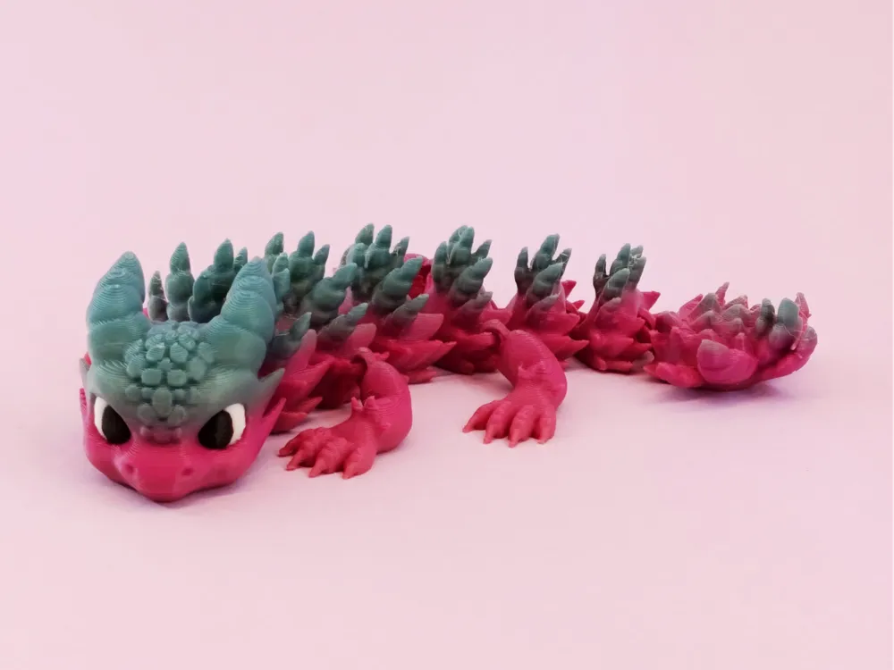 A pastel articulated baby dragon 3D print